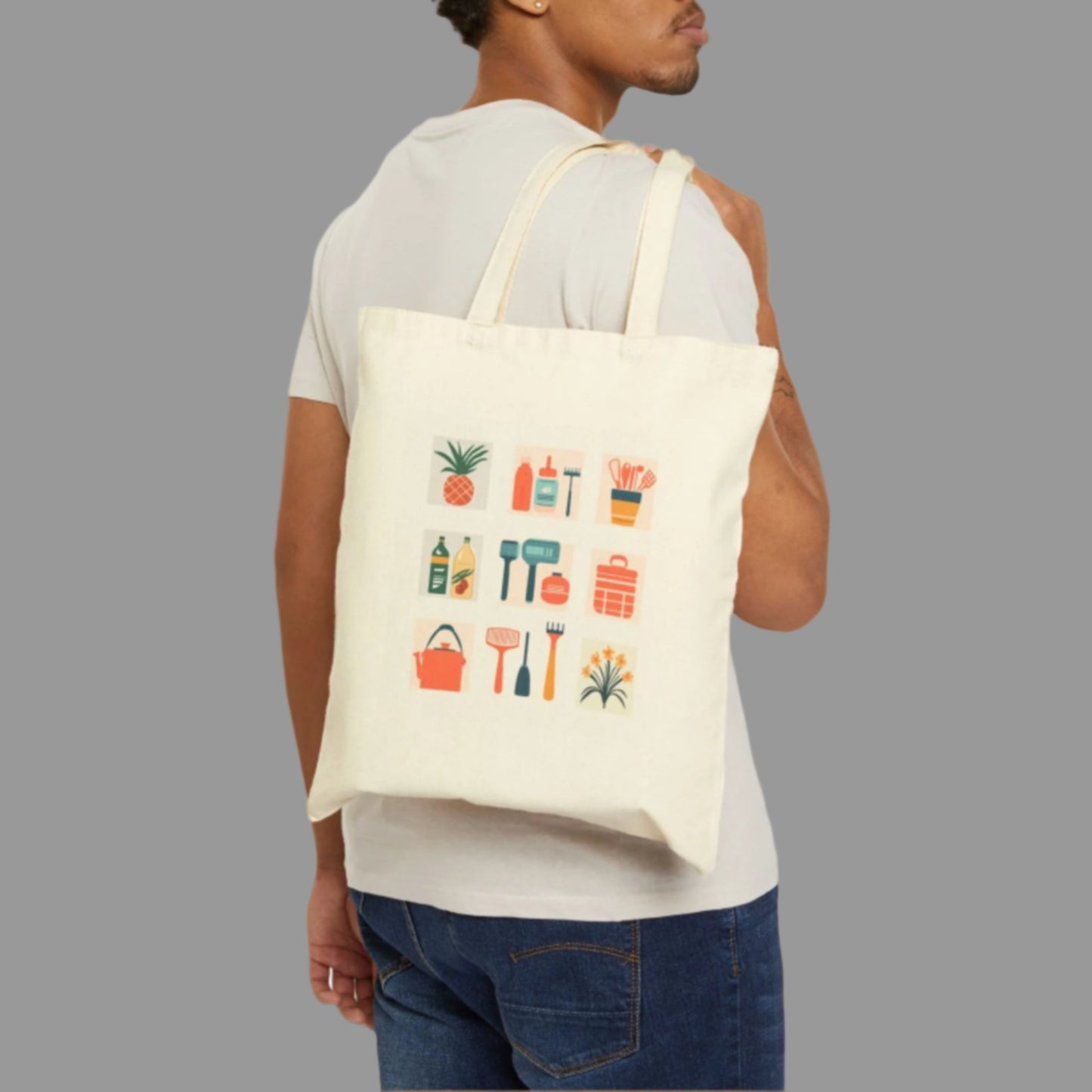 Man carrying a tote bag with colorful graphics on a white background
