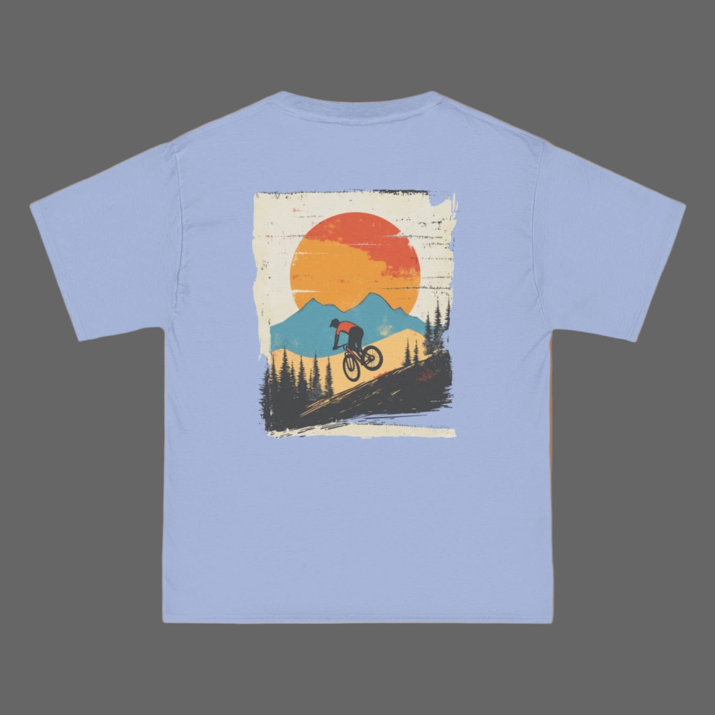 Blue t-shirt with a graphic print of a mountain biker against a sunset backdrop with mountains.