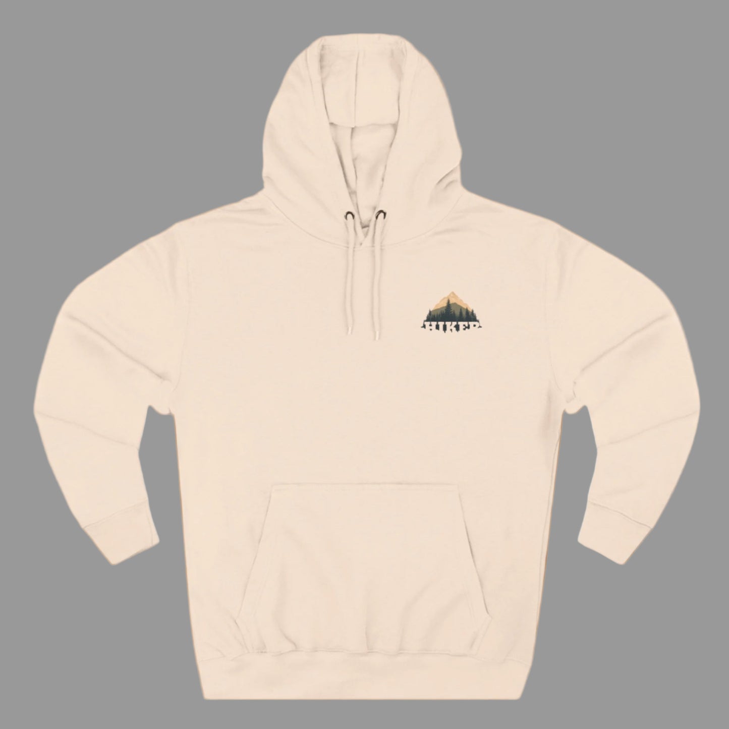 A person wearing a white fleece hoodie with a hood, featuring a small embroidery design on the chest.