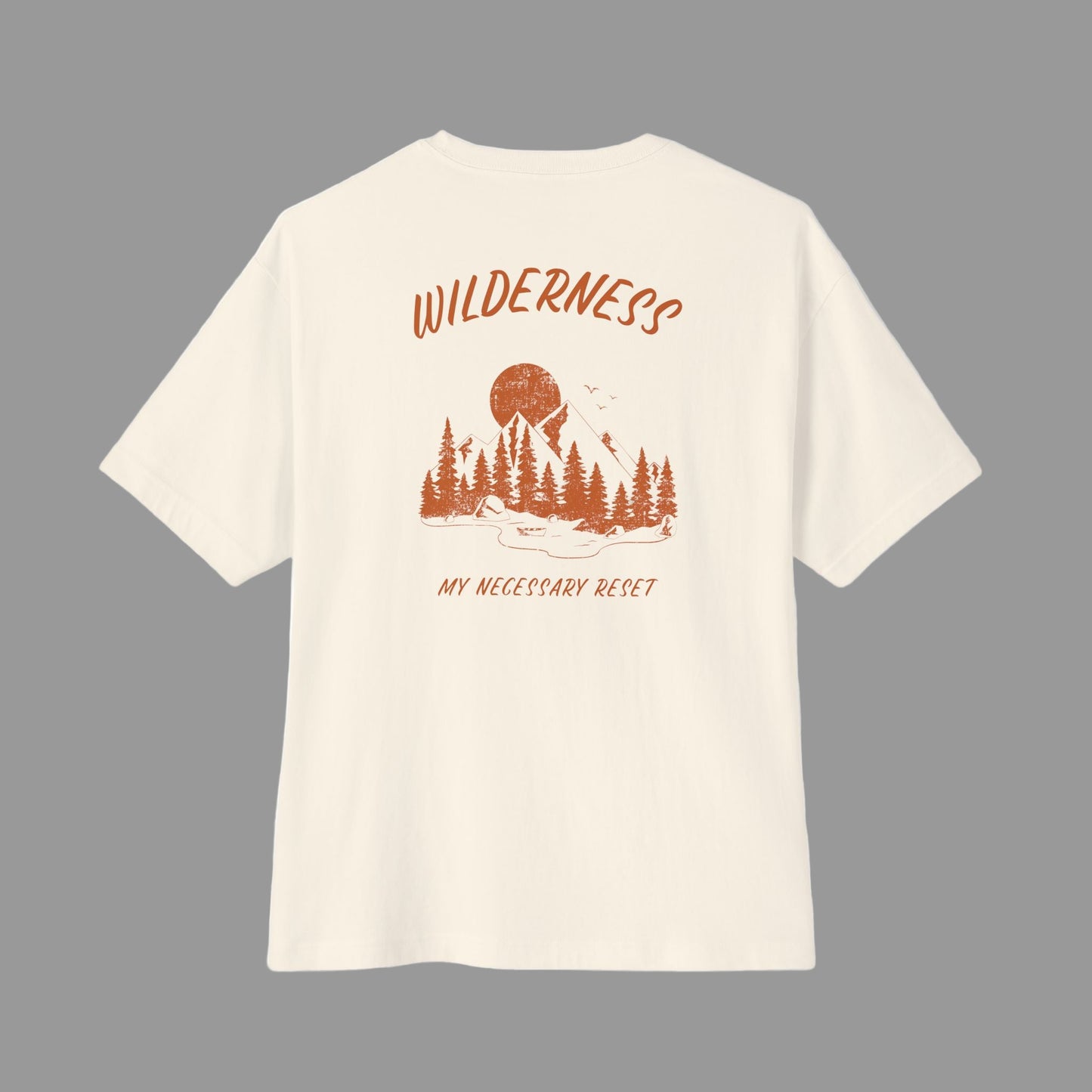 Beige t-shirt with 'Wilderness My Necessary Reset' design on a white background