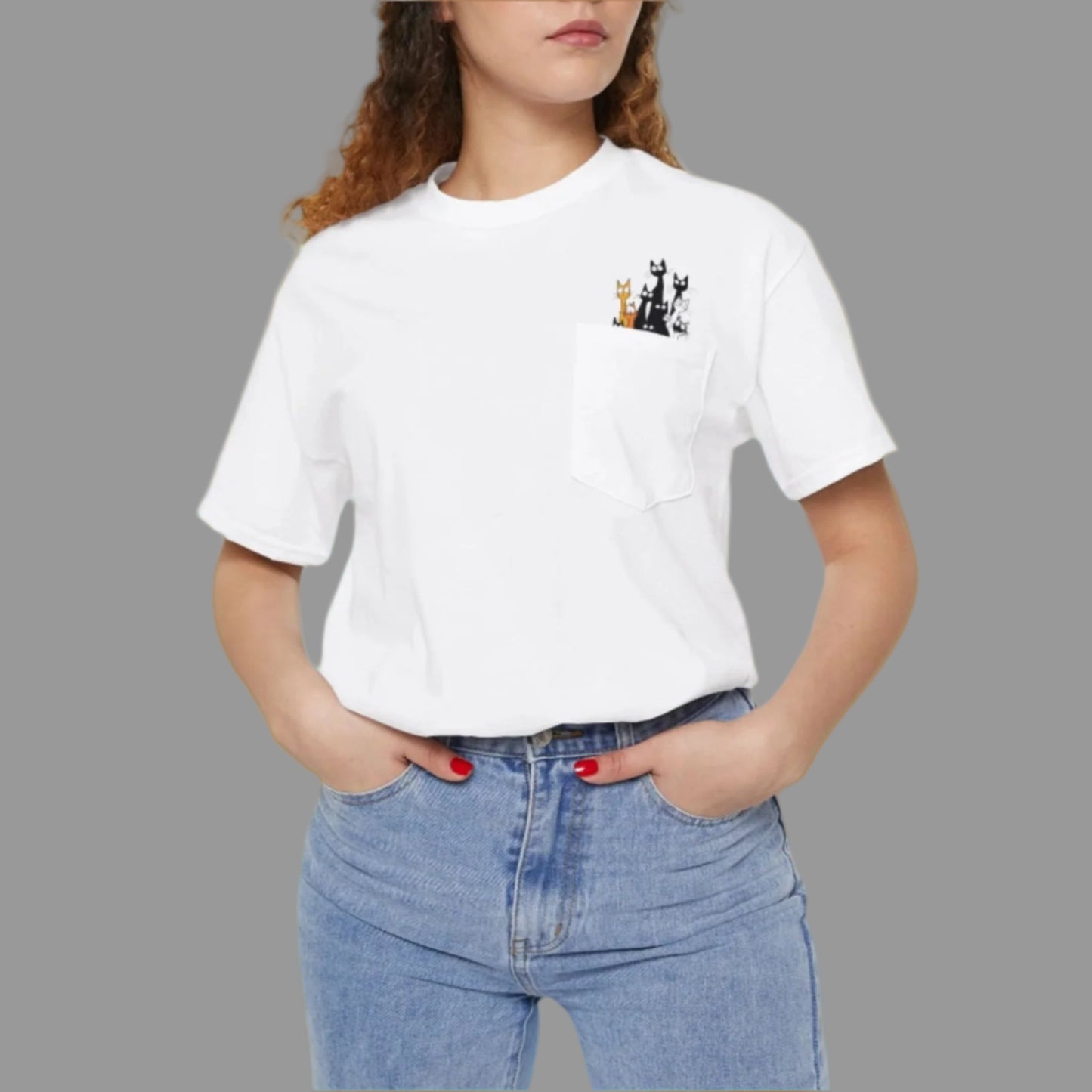 A person wearing a white crew neck t-shirt with a graphic in the left chest area, paired with blue jeans.