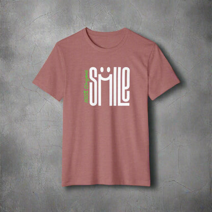 Mauve t-shirt with 'smile' graphic design on a white background