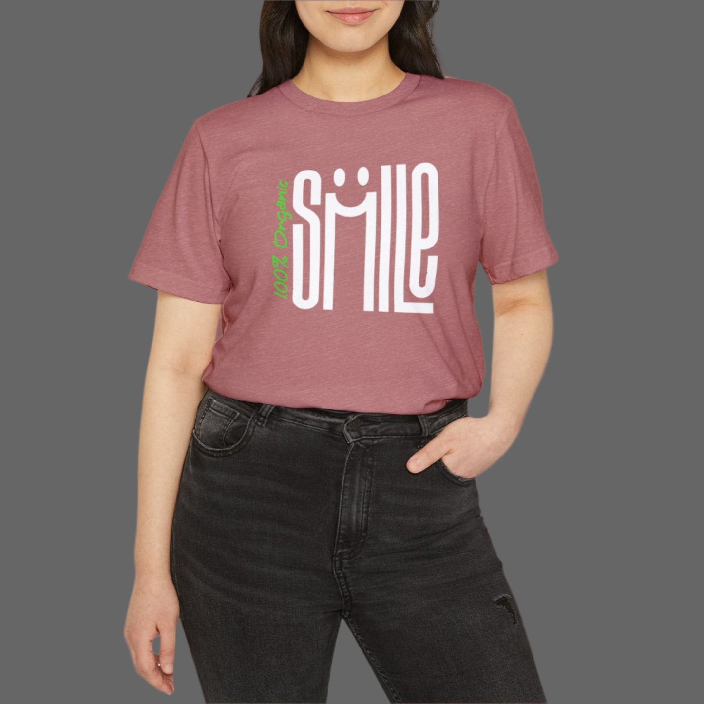 Person wearing a maroon t-shirt with 'SMILE' printed on it against a white background