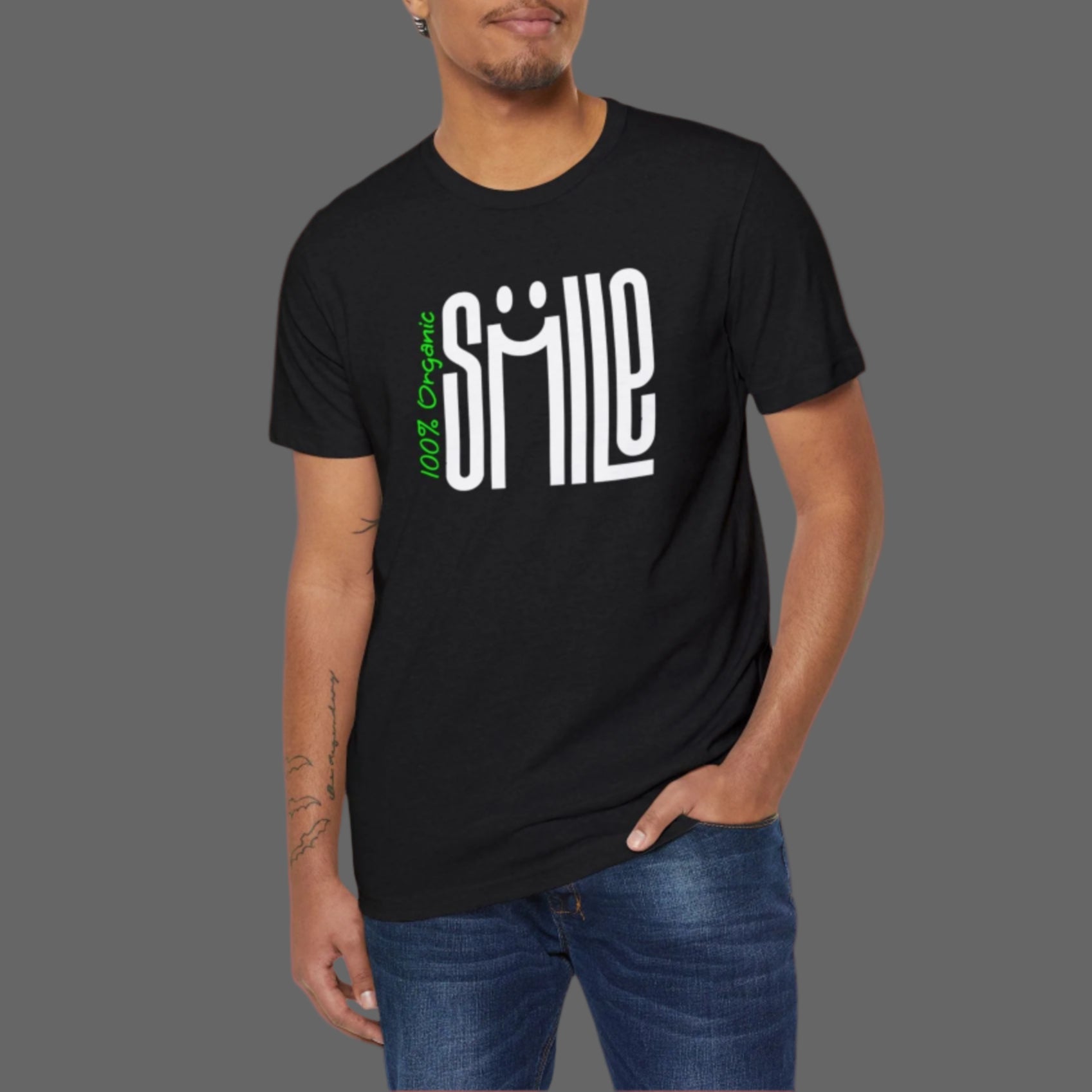 Man wearing a black t-shirt with a smiley face design on a white background