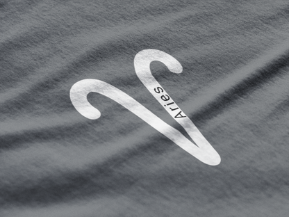 White Aries symbol on a gray t-shirt