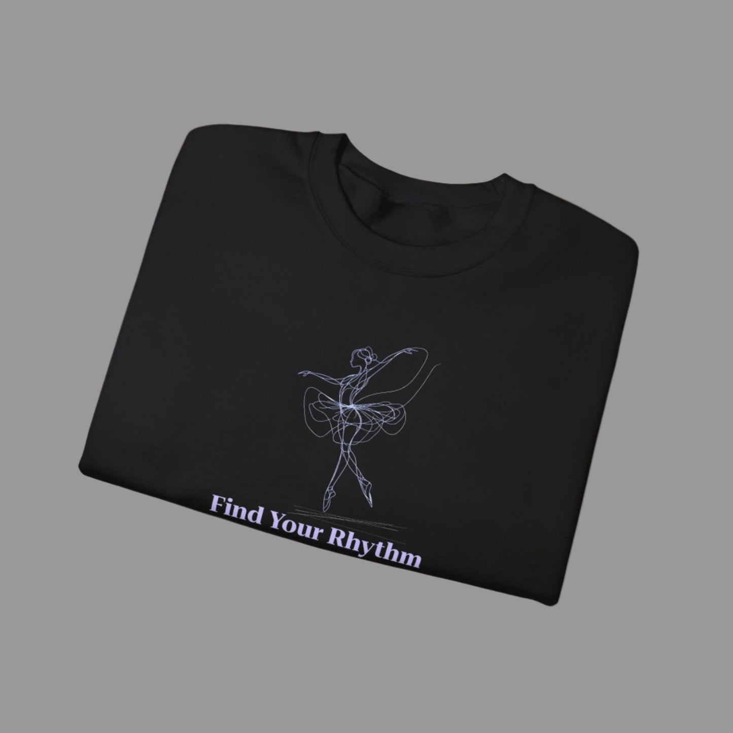 Folded black t-shirt with a white graphic and text 'Find Your Rhythm' on a white background