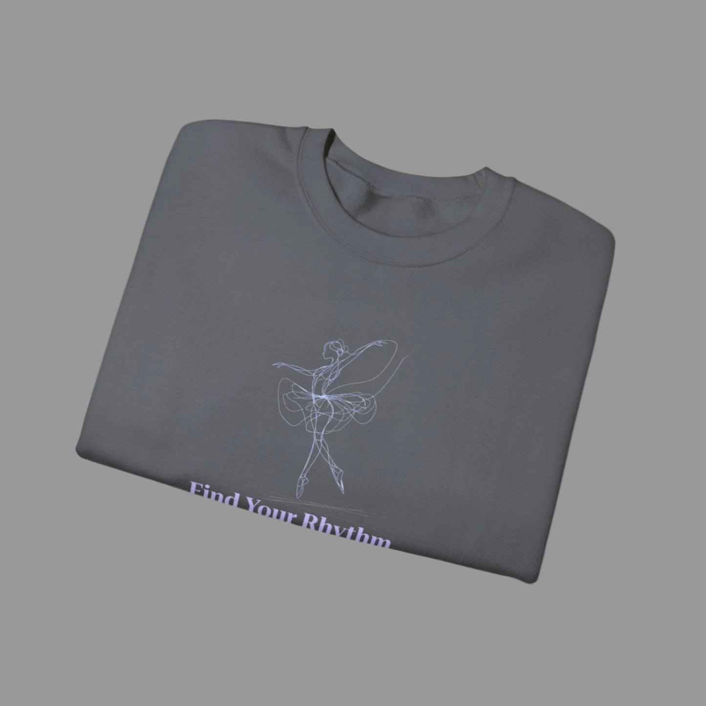 Folded gray t-shirt with a ballet dancer design and text on a white background