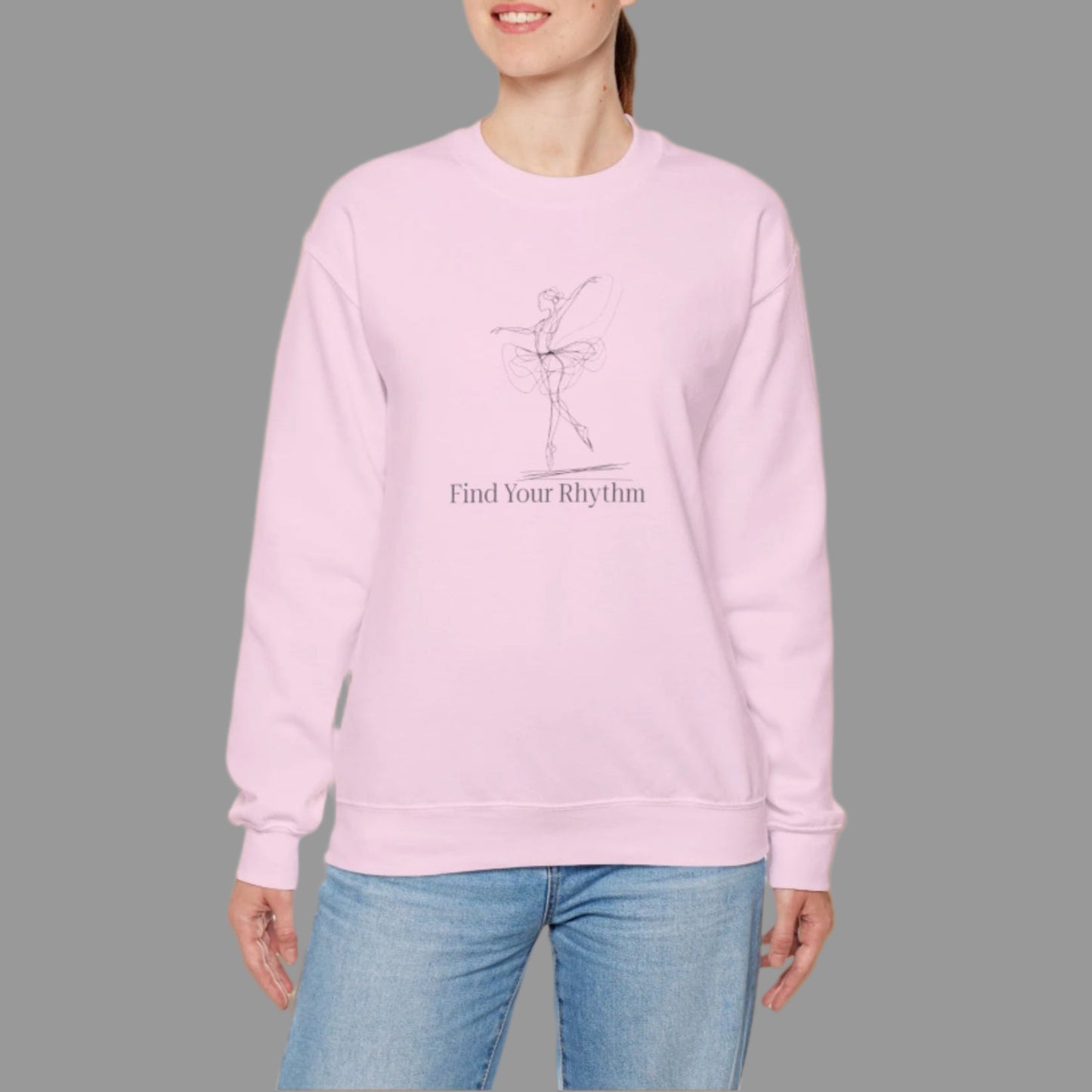Person wearing a pink sweatshirt with text and graphics on a white background