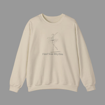 Beige sweatshirt with a graphic of a dancer and text 'Find Your Rhythm' on a white background