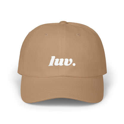 Brown cap with 'luv.' text on a white background