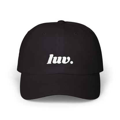 Black cap with 'luv.' text on a white background
