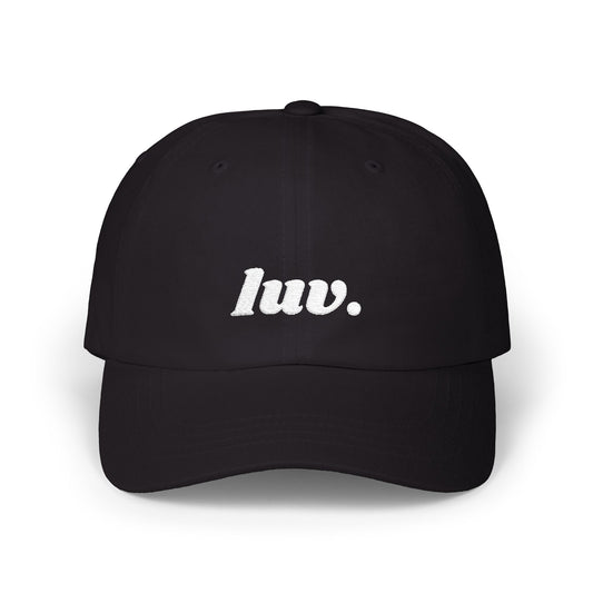 Black cap with 'luv.' text on a white background
