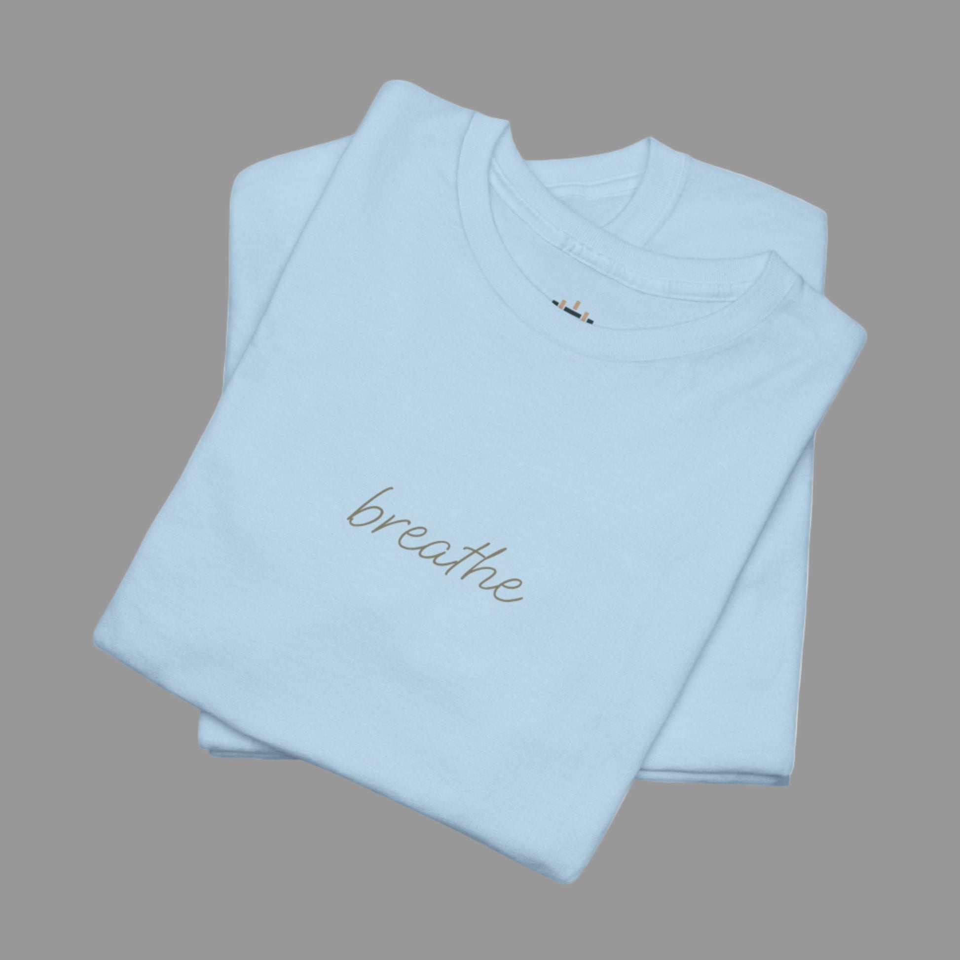 Light blue t-shirt with 'breathe' text on a white background