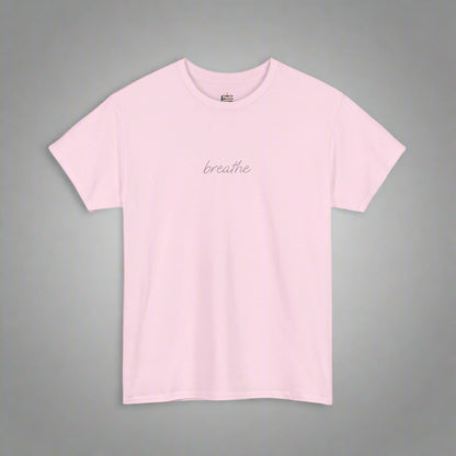 Pink t-shirt with 'breathe' text on a white background