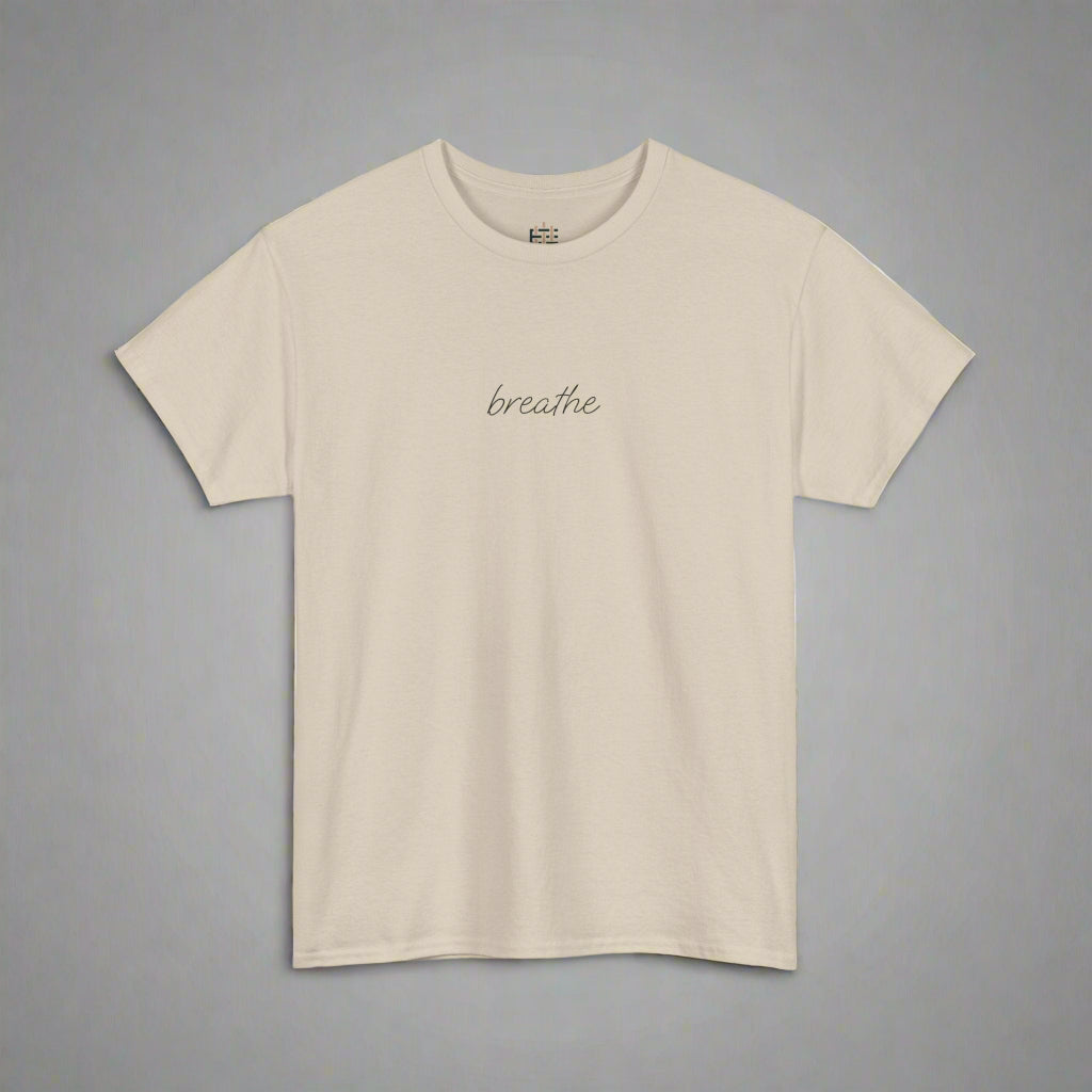 Beige t-shirt with 'breathe' text on a white background