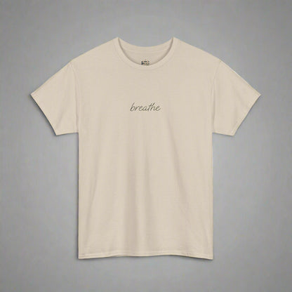 Beige t-shirt with 'breathe' text on a white background
