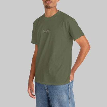 Man wearing a green t-shirt with text on a white background