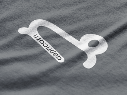 Capricorn zodiac symbol on a textured gray background