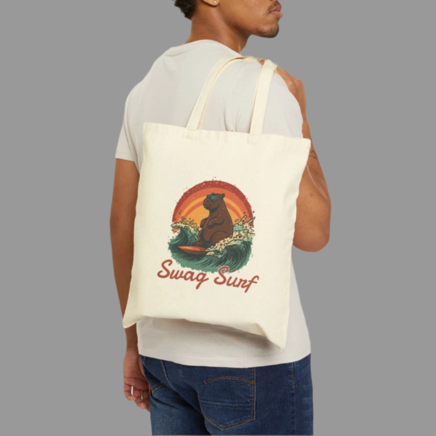 Man carrying a tote bag with a dog graphic and 'Swag Surf' text on a white background