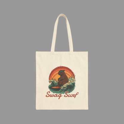 Tote bag with a bear surfing design and 'Swag Surf' text on a white background