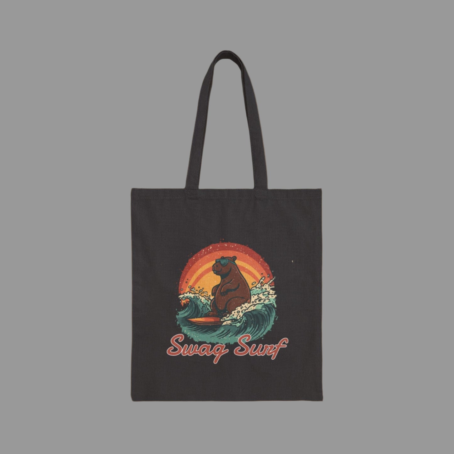 Black tote bag with a bear surfing design and 'Swag Surf' text on a white background
