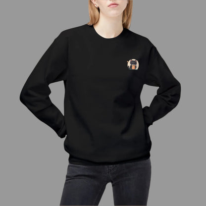 Person wearing a black sweatshirt with a small design on the chest against a white background