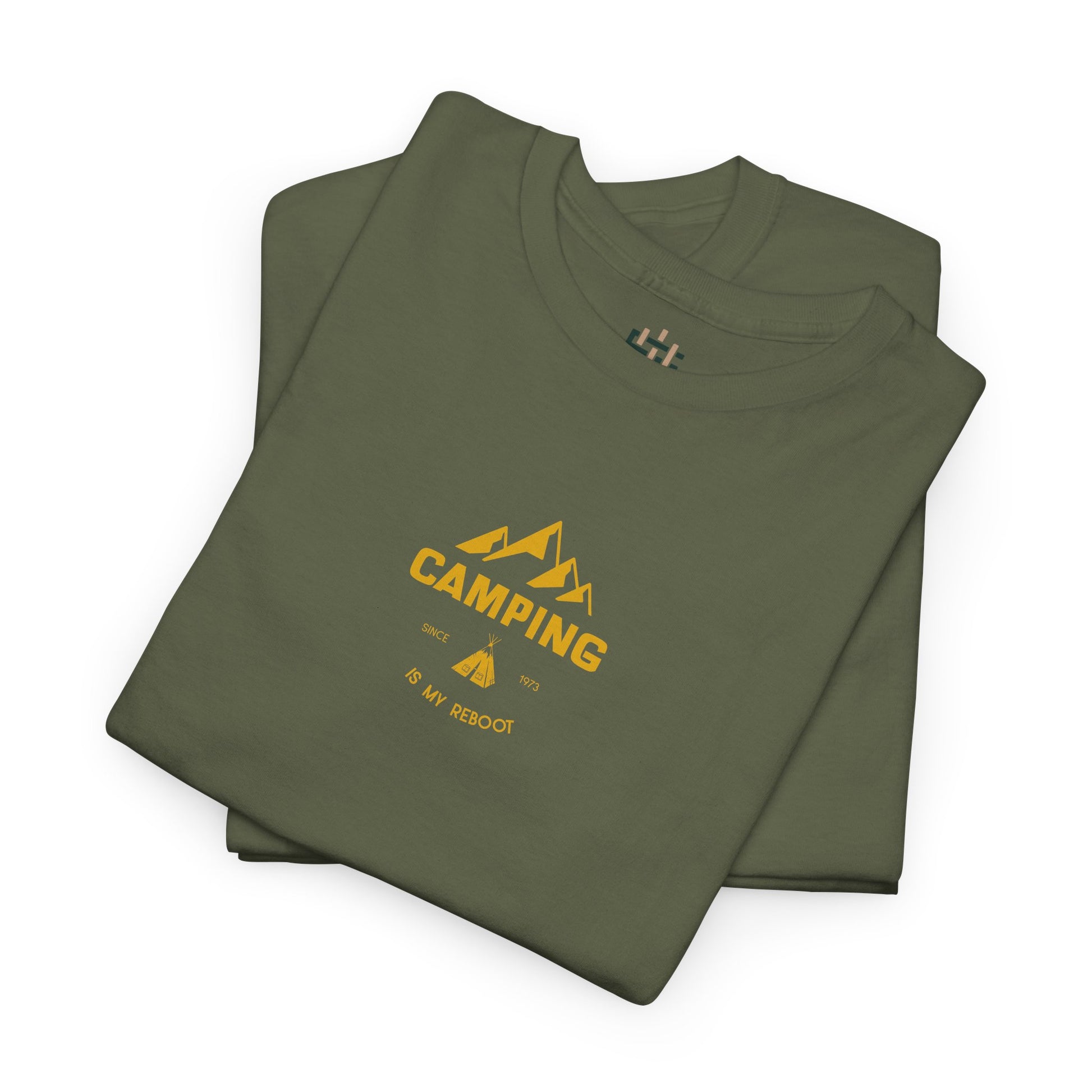 Folded green t-shirt with yellow 'Camping is my Religion' text on a white background