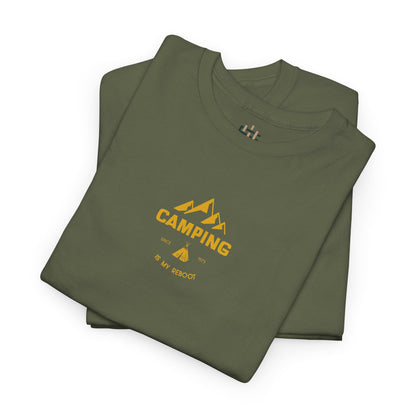 Folded green t-shirt with yellow 'Camping is my Religion' text on a white background