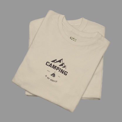 Folded beige t-shirt with 'Camping is my Retreat' text on a white background