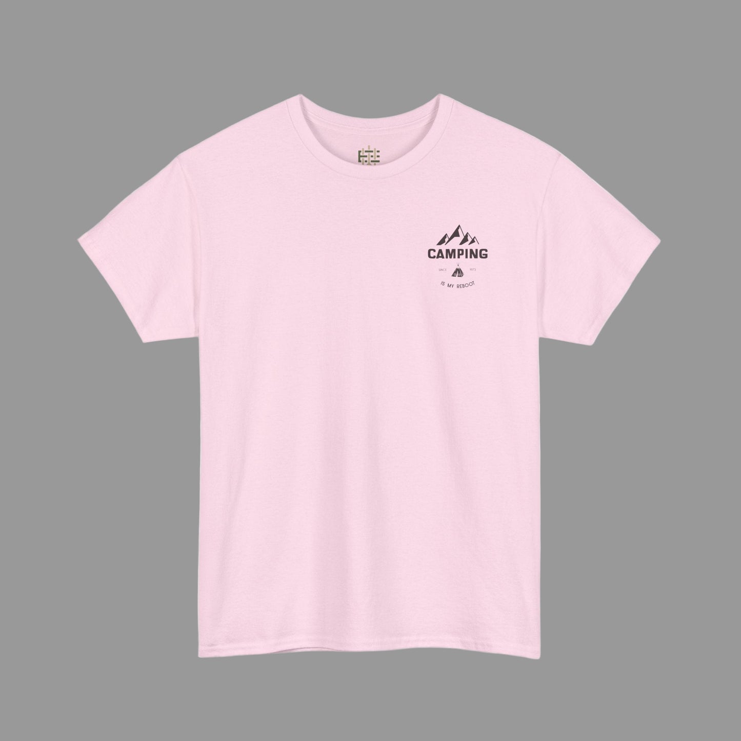 Pink t-shirt with a camping graphic on a white background