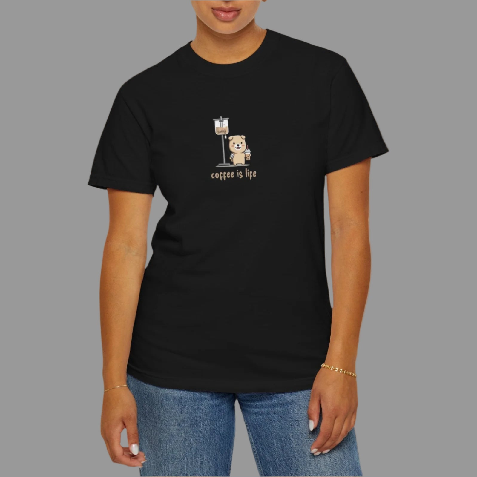 Person wearing a black t-shirt with a graphic design on a white background