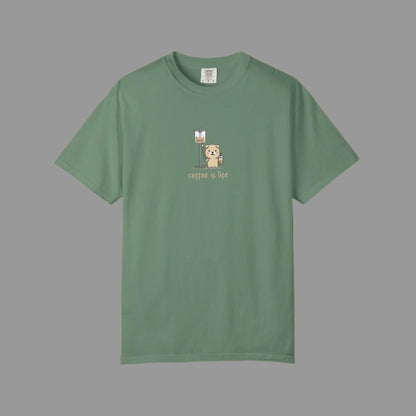 Green t-shirt with a bear and coffee cup graphic on a white background
