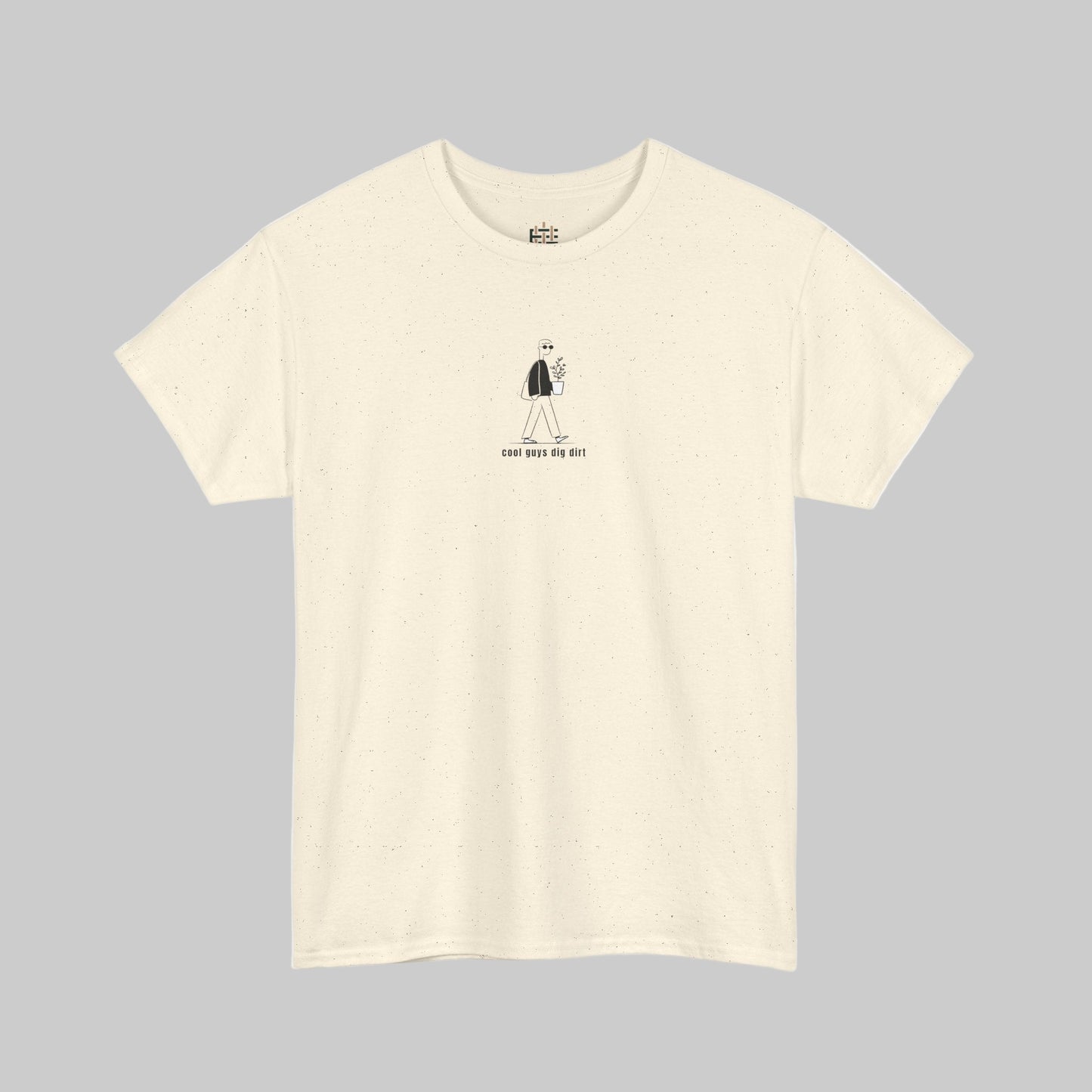 Beige t-shirt with a small black graphic and text on a white background
