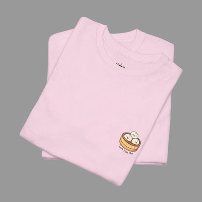 Folded pink t-shirt with a small logo on a white background