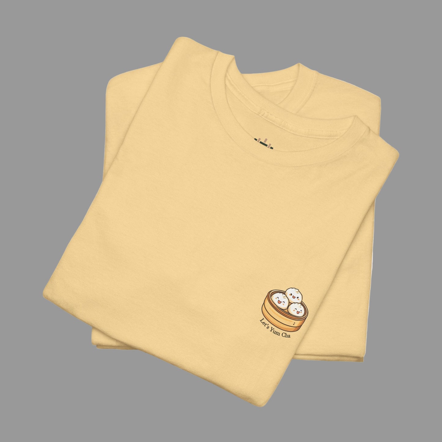 Folded beige t-shirt with a small logo on a white background