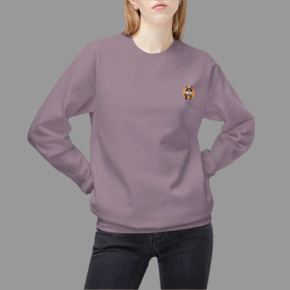 Person wearing a purple sweatshirt with a small logo on a white background