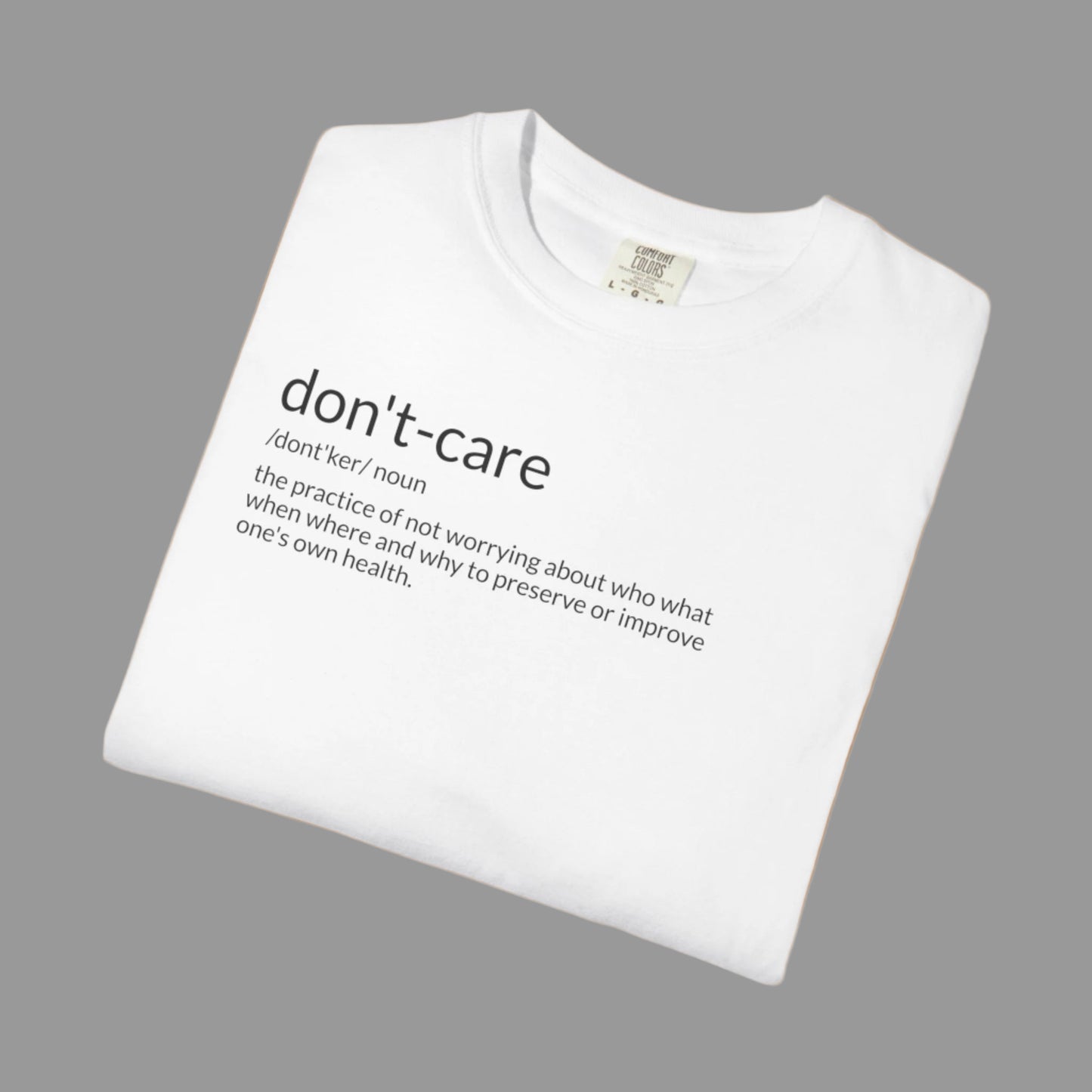 White t-shirt with 'don't-care' text on a white background