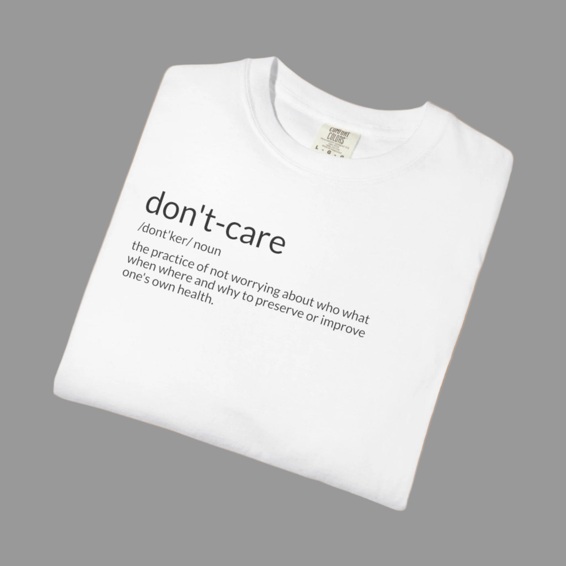 White t-shirt with 'don't-care' text on a white background