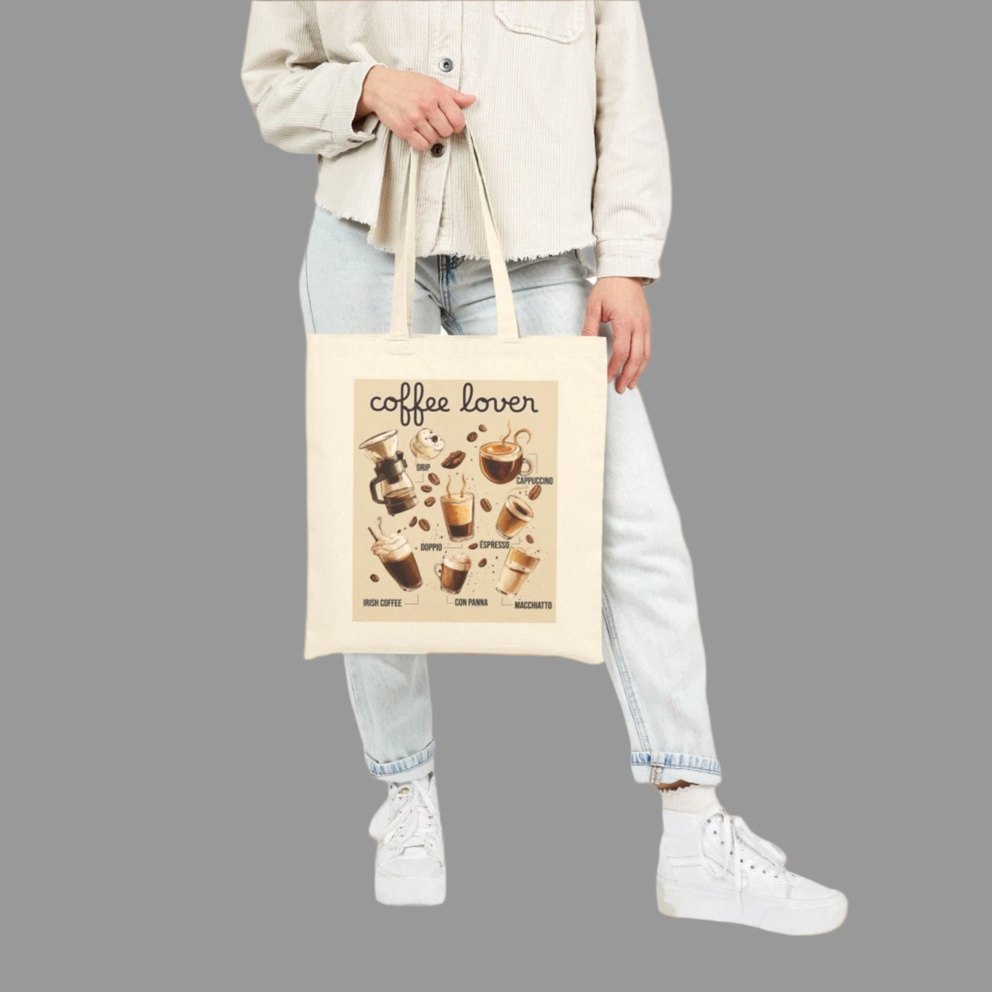 Person holding a tote bag with 'coffee lover' design on a white background