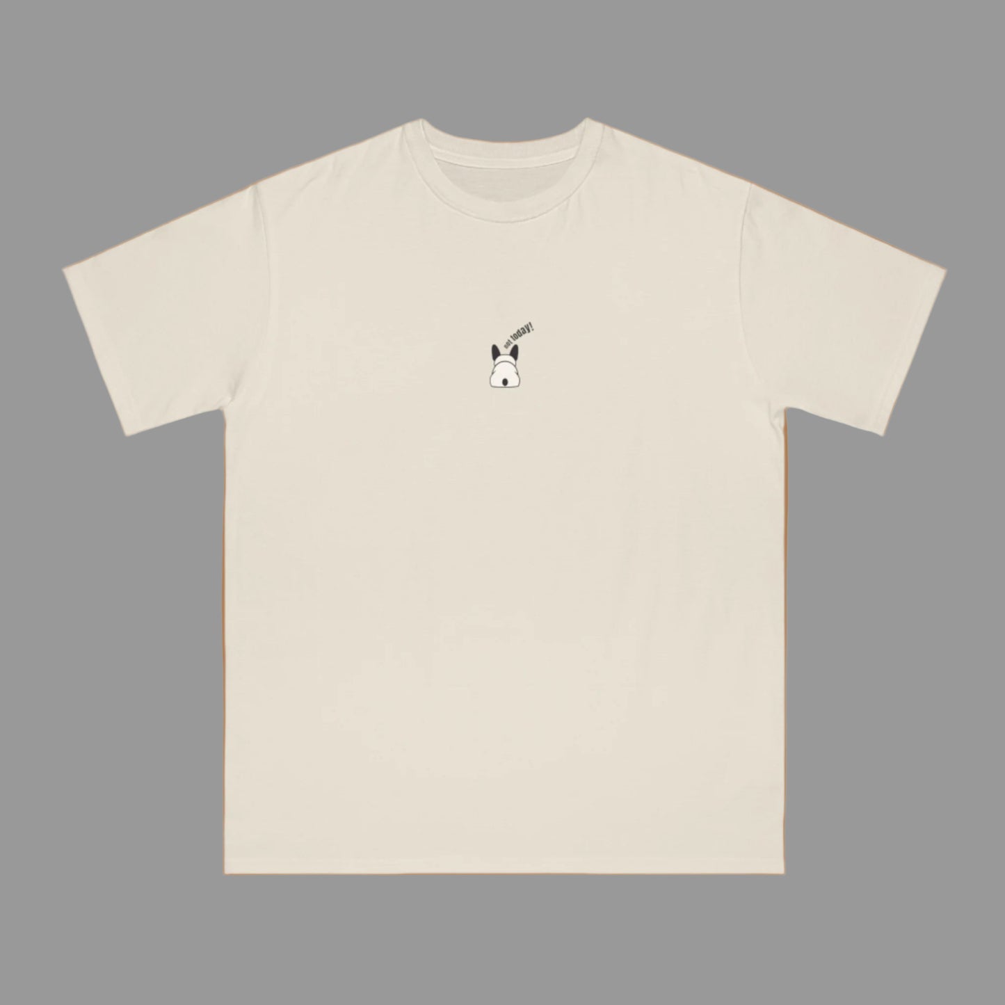 Beige t-shirt with a small dog graphic on a white background