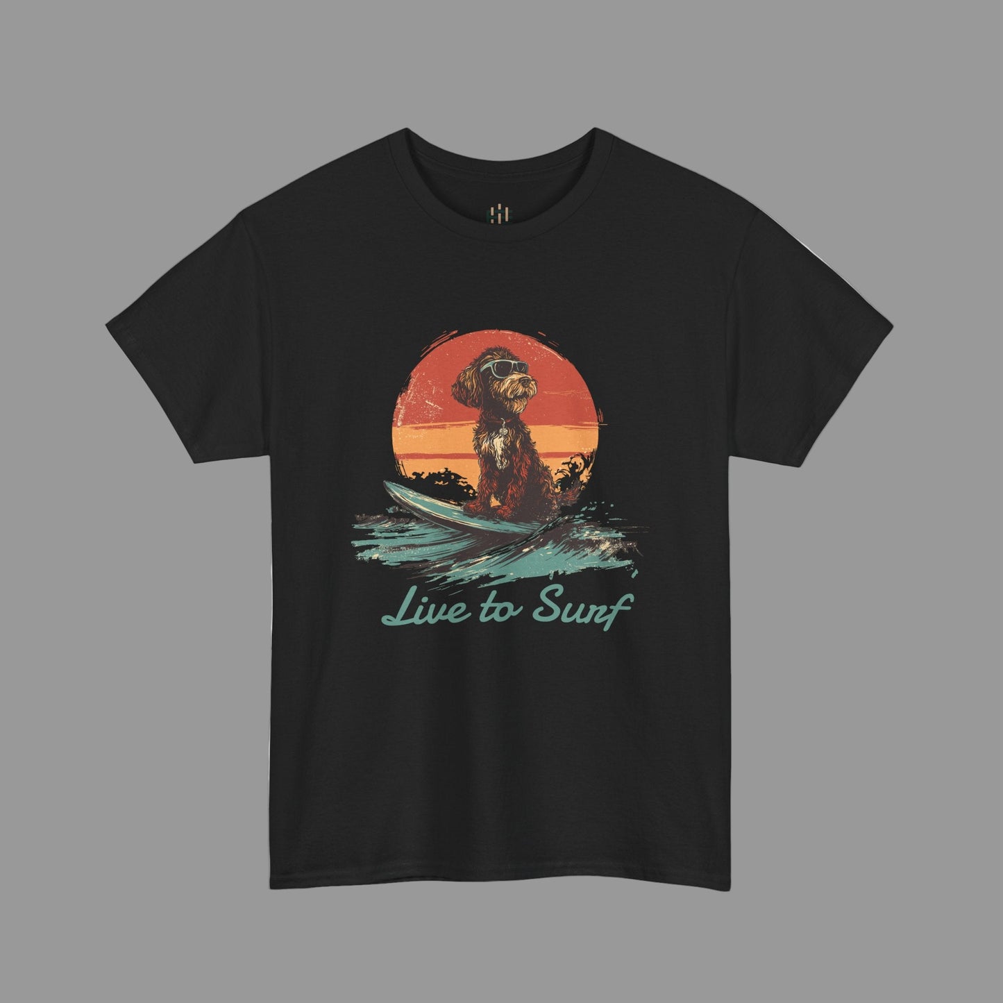 Black t-shirt with a graphic of a dog on a surfboard and 'Live to Surf' text against a sunset background.
