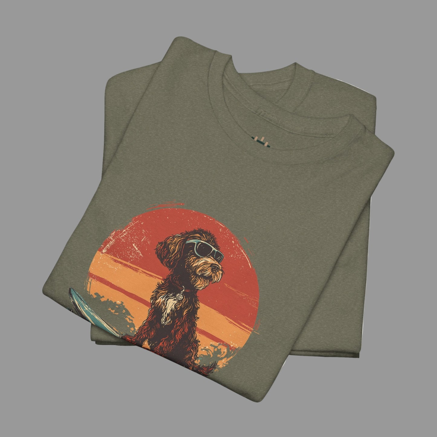 Folded green t-shirt with a dog graphic on a white background