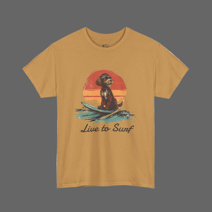 Mustard yellow t-shirt with a graphic of a dog on a surfboard and 'Live to Surf' text, on a white background.