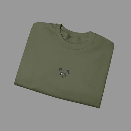 Folded green sweatshirt with a small panda design on a white background