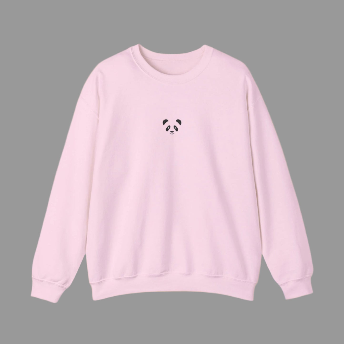 Pink sweatshirt with a small black panda design on a white background