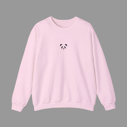 Pink sweatshirt with a small black panda design on a white background