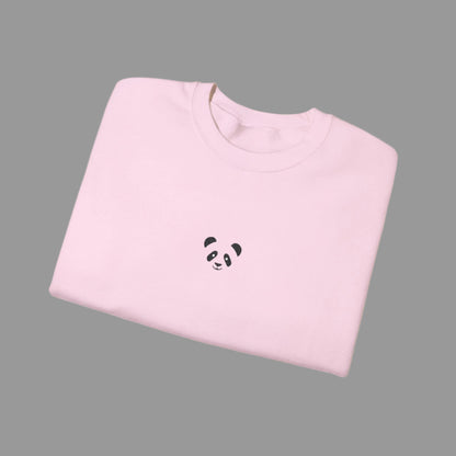 Folded pink sweatshirt with a panda design on a white background