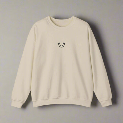 Beige sweatshirt with a small panda design on a white background