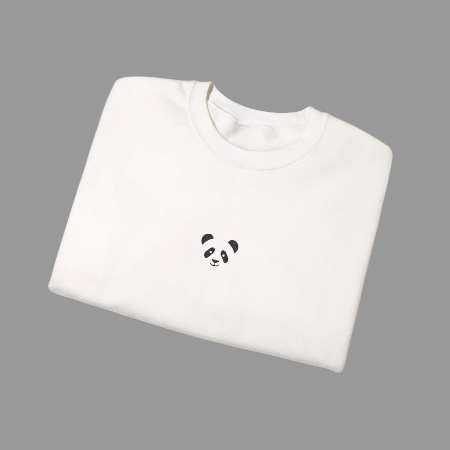 White sweatshirt with a panda face design on a white background