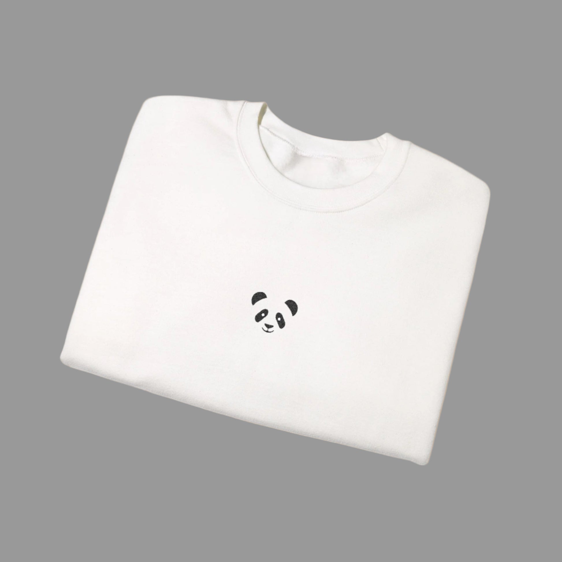 White sweatshirt with a panda face design on a white background